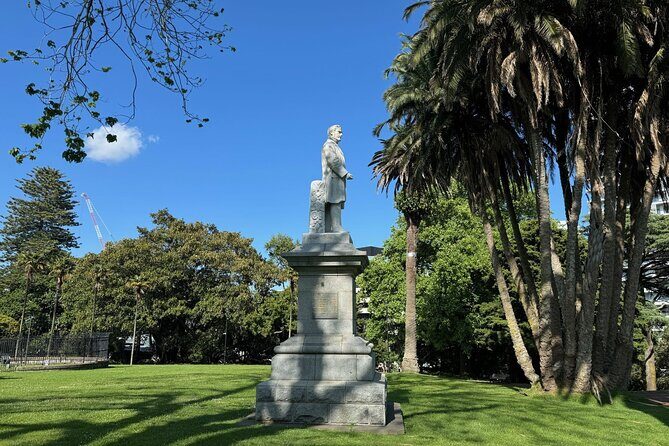 A Self-Guided Walking Tour of Auckland's Hidden Stories - Ferry Building, Sky Tower, and the Viaduct Harbour walk toward the water