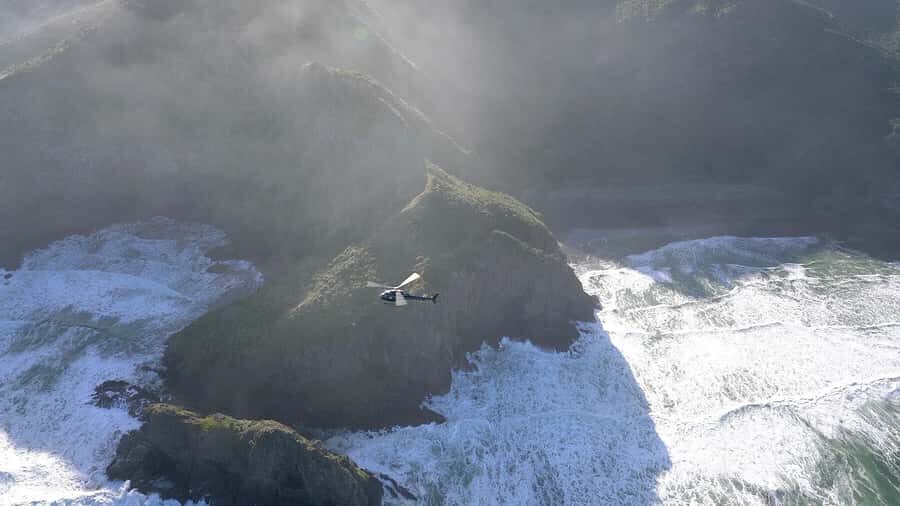 Auckland: 36 min scenic helicopter flight - Coast to Coast - From Albany out toward Bethells (Te Henga): black sand and volcanic rock